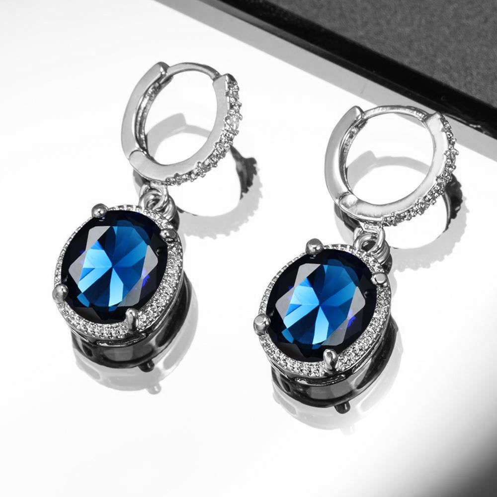 Silver-Tone Royal Blue Oval Crystal Halo Huggie Earrings