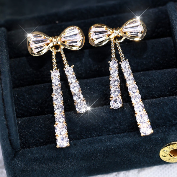 Gold-Tone White Crystal Bow Stud Earrings with Tassel Drops