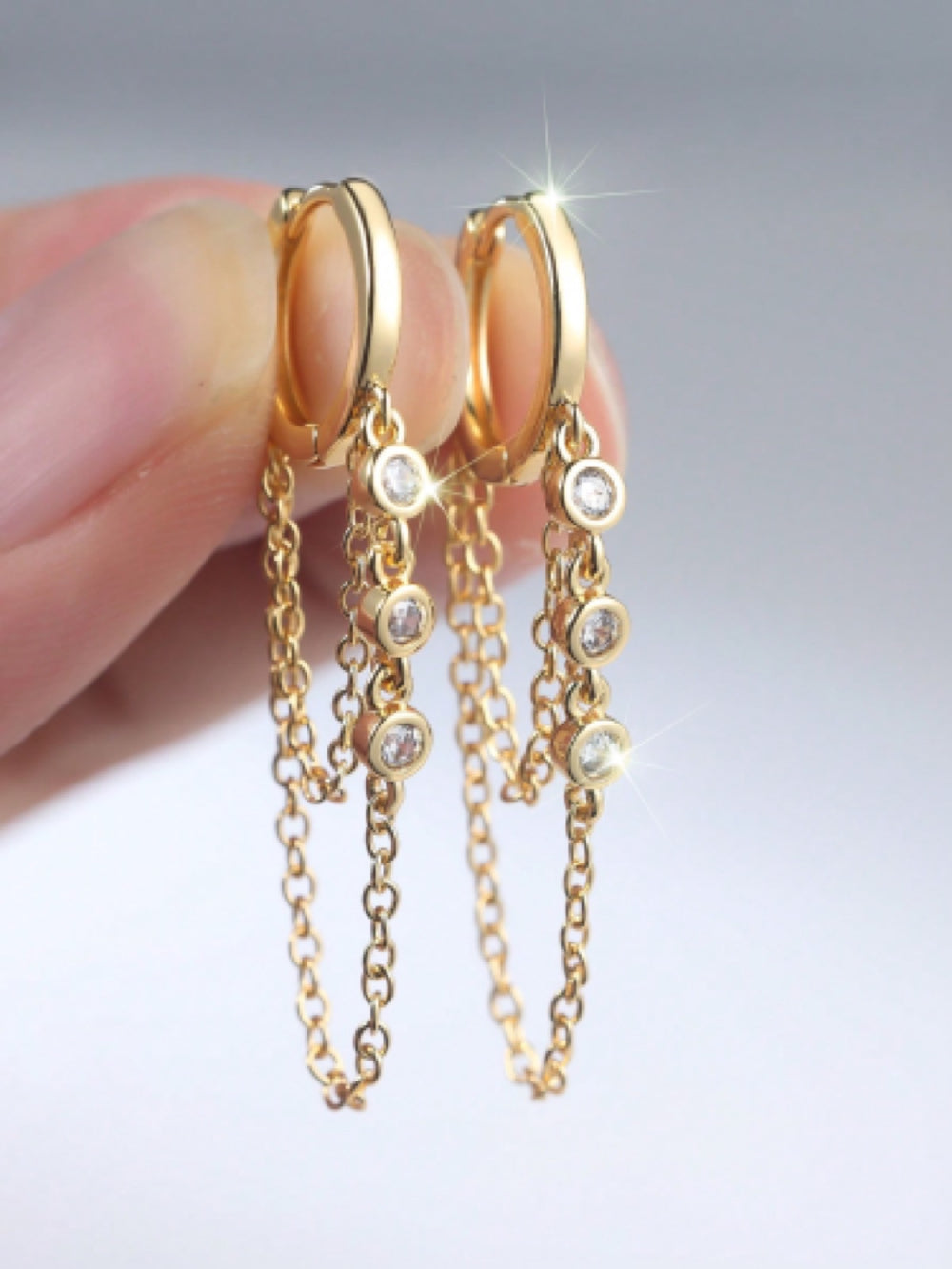 Gold-Tone Triple White Crystal Draped Chain Huggie Earrings
