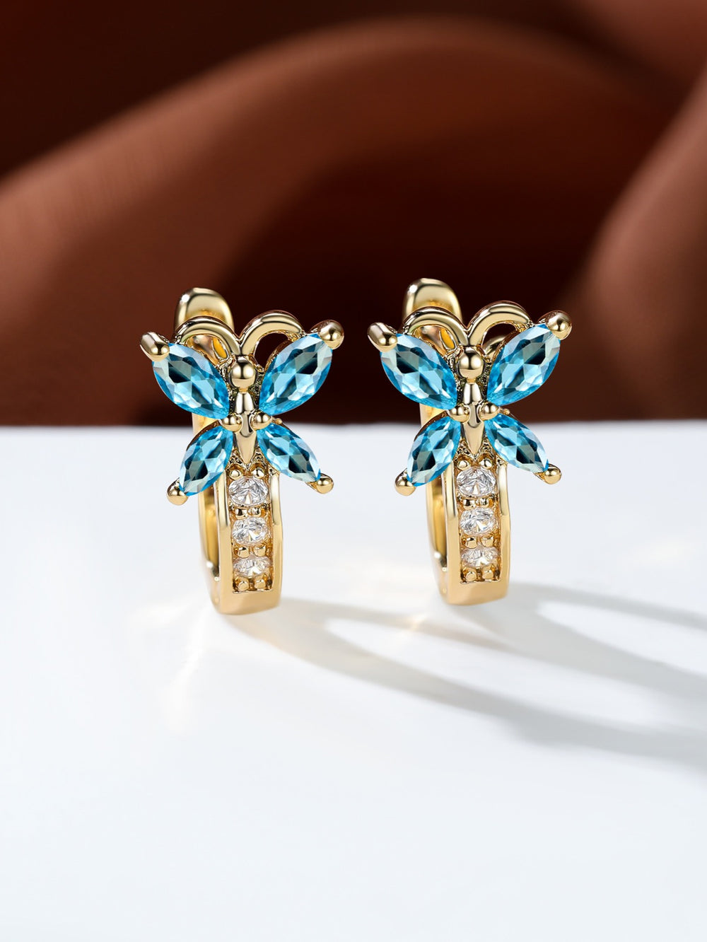 Gold-Tone Aqua Blue Crystal Marquise Butterfly Huggie Earrings