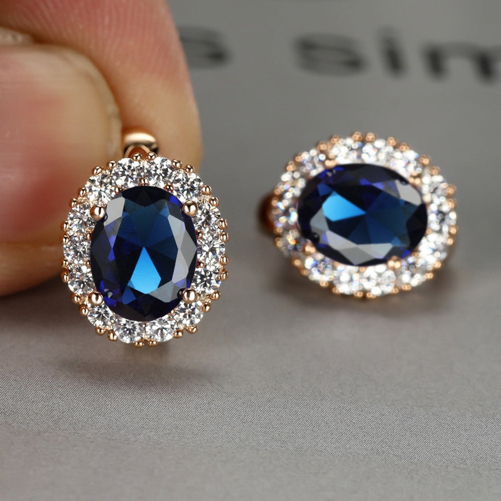Champagne Gold-Tone Royal Blue Oval Crystal Halo Stud Earrings