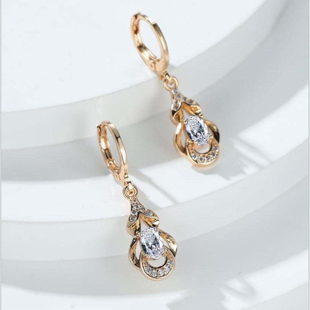 Champagne Gold-Tone White Oval Crystal Huggie Earrings