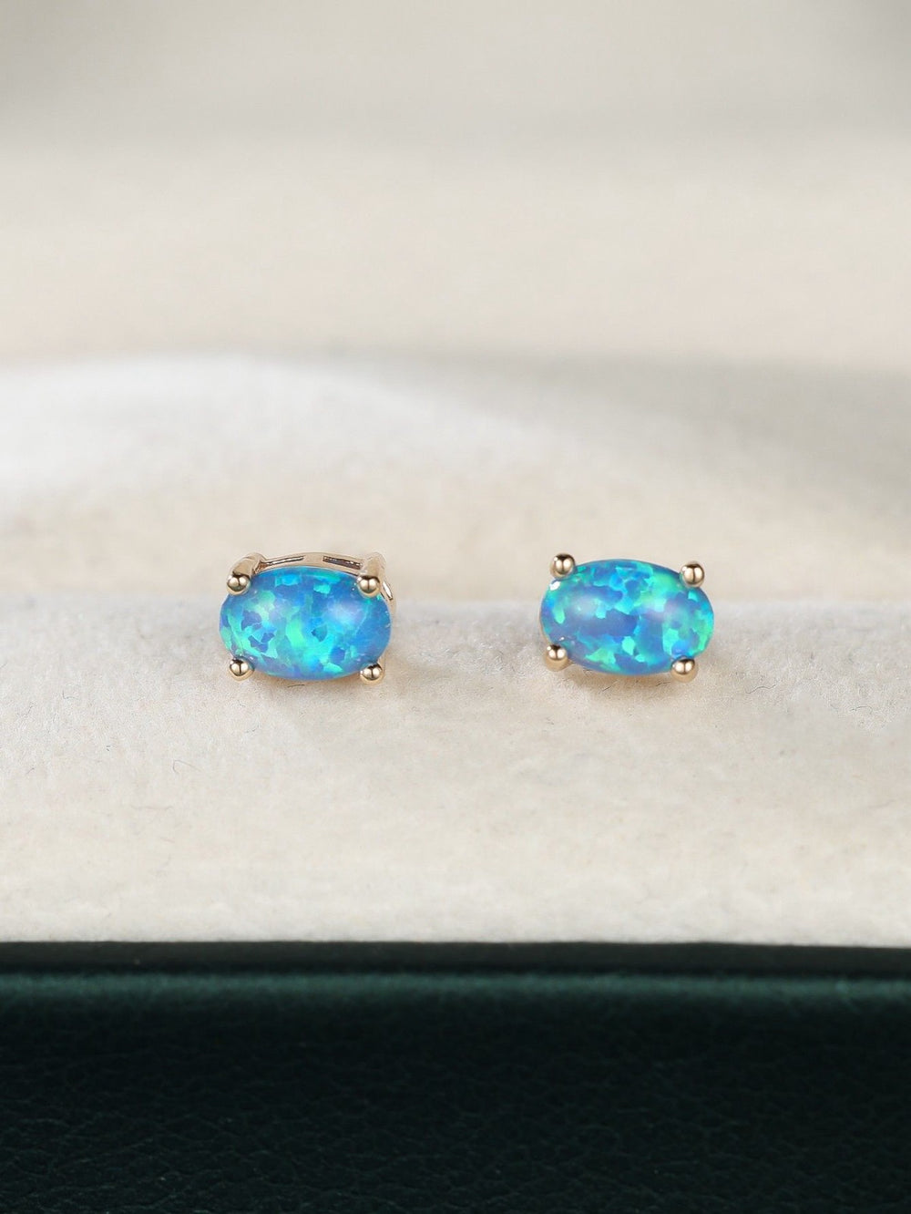 Champagne Gold-Tone Oval Blue Simulated Opal Four-Prong Stud Earrings