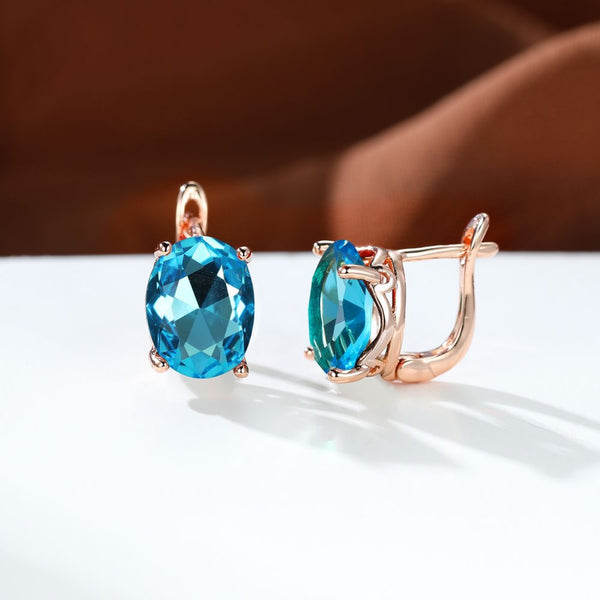 Rose Gold-Tone Aqua Blue Oval CZ Solitaire Huggie Earrings